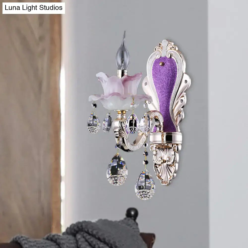 Elegant frosted glass purple wall sconce with teardrop crystal droplets and ornate silver floral metalwork for bedroom