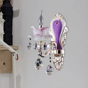 Modern frosted glass purple wall sconce featuring teardrop crystal pendants and pink glass flower accent for bedroom use