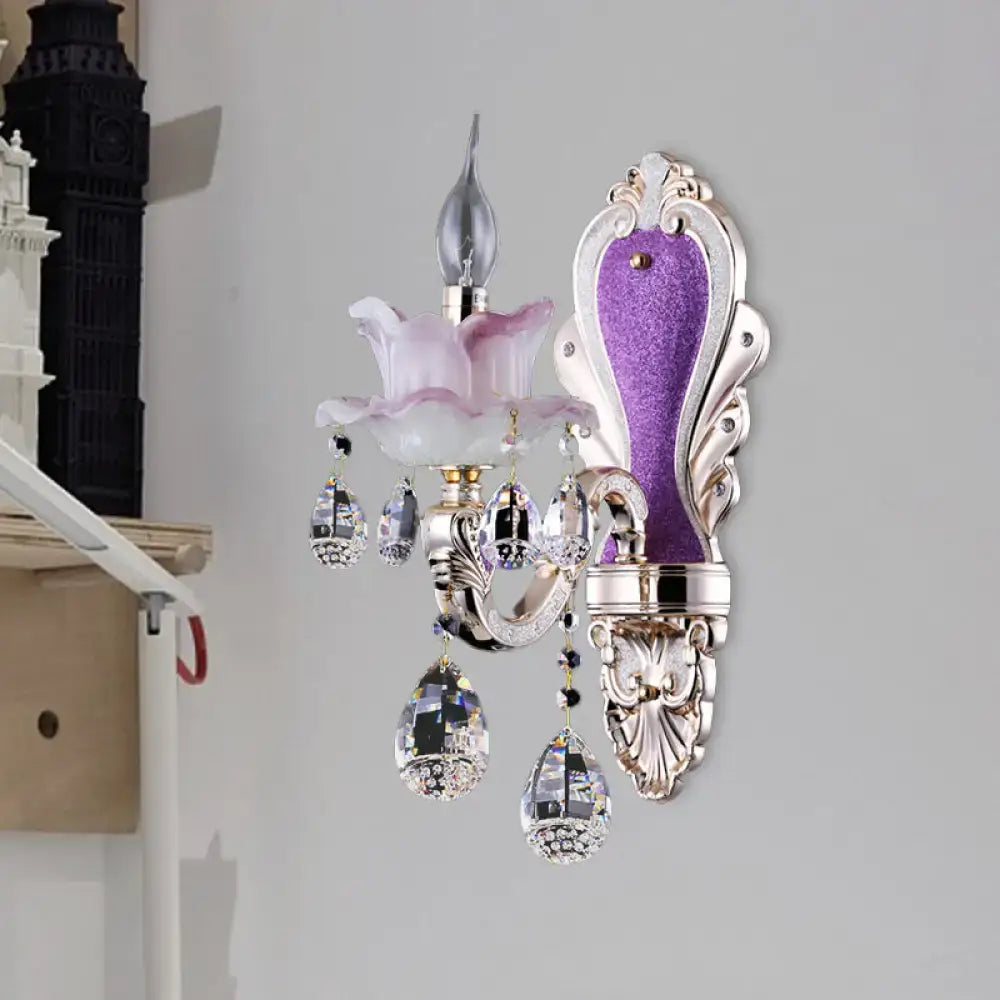 Modern frosted glass purple wall sconce featuring teardrop crystal pendants and pink glass flower accent for bedroom use