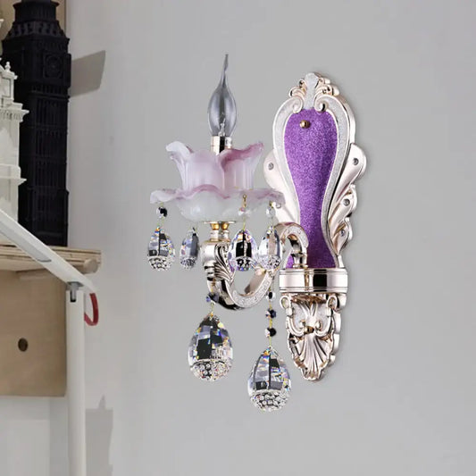 Modern frosted glass purple wall sconce featuring teardrop crystal pendants and pink glass flower accent for bedroom use