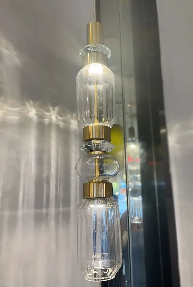 Modern geometric amber and clear glass chandelier with gold-toned metal accents from decorbites glass chandelier collection