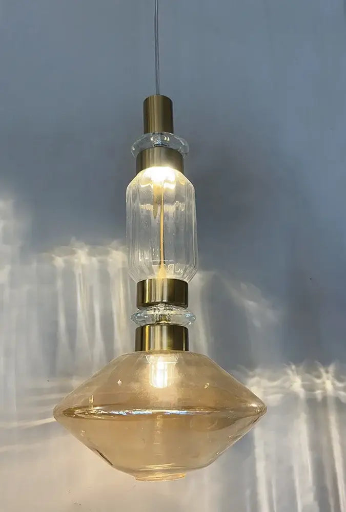 Modern geometric amber and clear glass chandelier dining room light with faceted pendant and brass accents by decorbites glass chandelier
