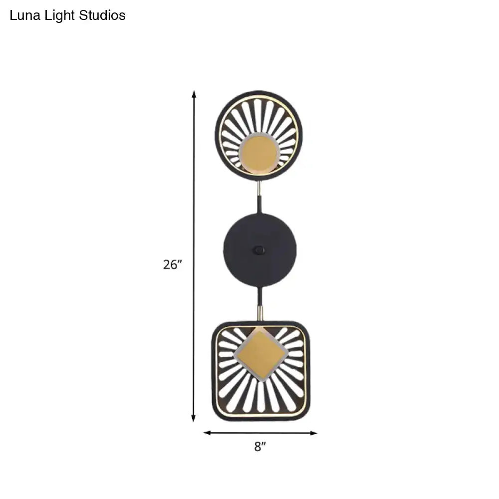 Modern geometric black and gold wall lamp with sunburst patterns ideal for living room use and maximum bulb wattage compatibility
