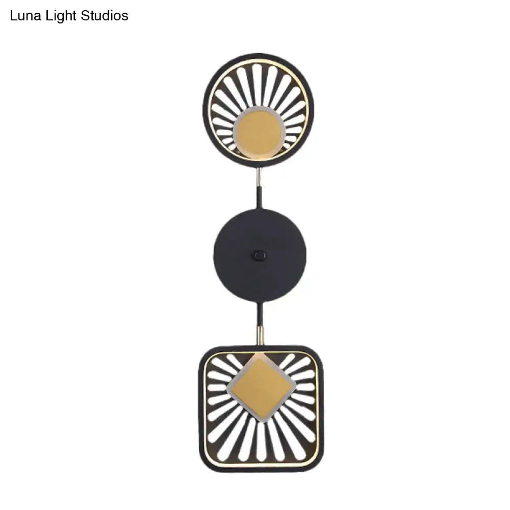 Modern geometric black and gold wall lamp with sunburst design and maximum bulb wattage for living room decor