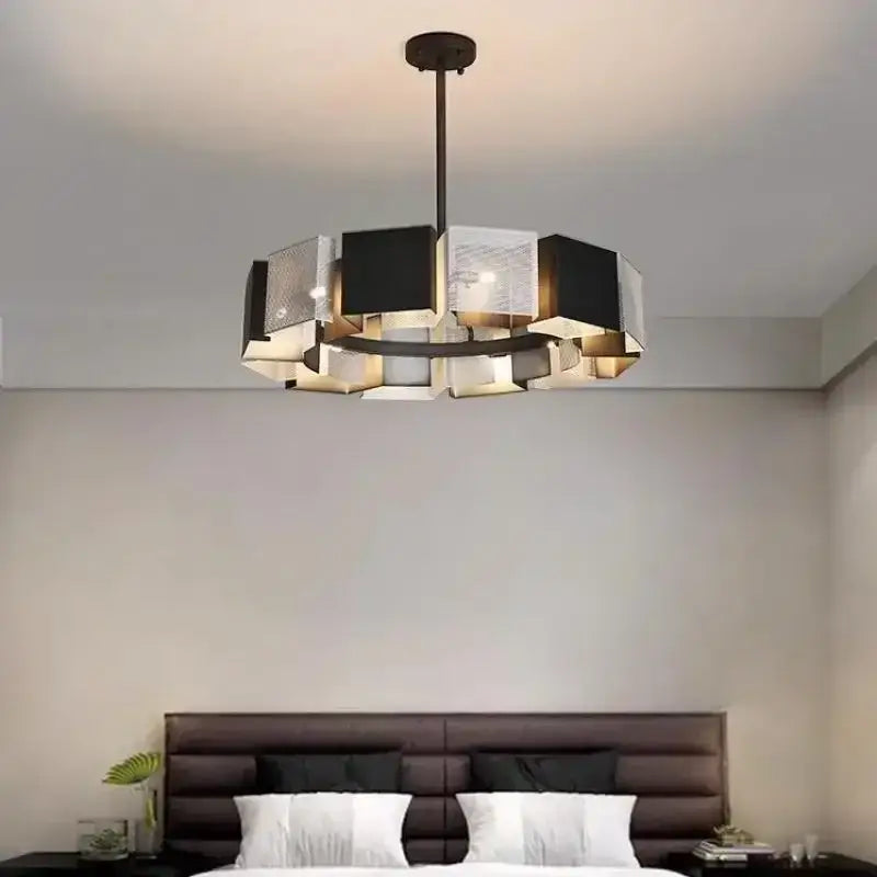Modern geometric black metal loft led chandelier with metallic silver panels suspended by a dark metal rod for dining room decorbites black metal