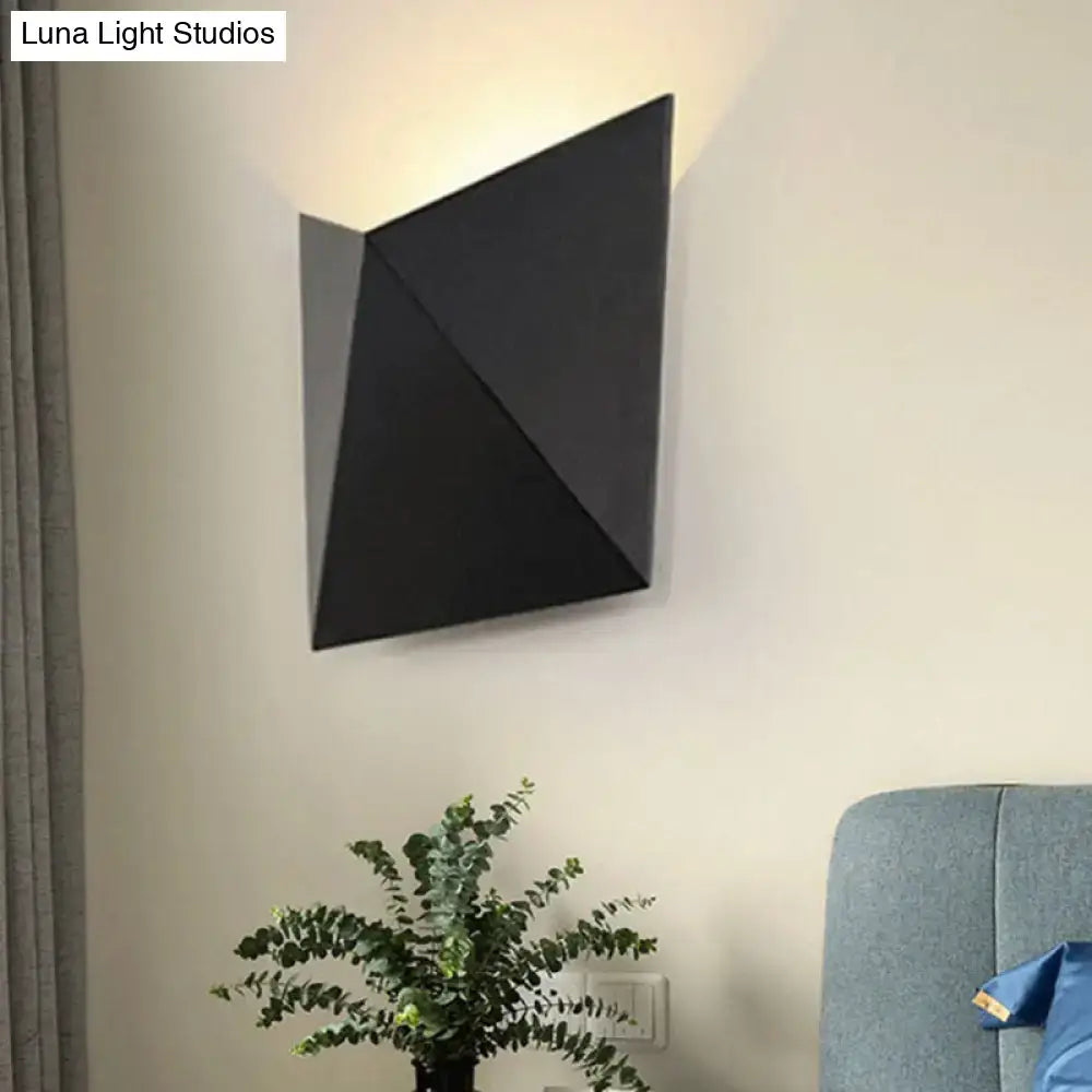 Modern geometric black metal wall sconce with angular folded design for bedroom wall lamp and metal wall sconce lighting