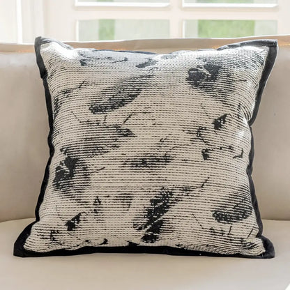 Modern geometric black and cream embroidered pillow cover with woven abstract pattern for living room decor