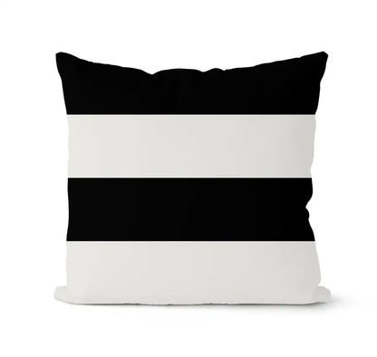 Modern geometric black and white pillowcase set featuring a black and white striped throw pillow with bold horizontal bands