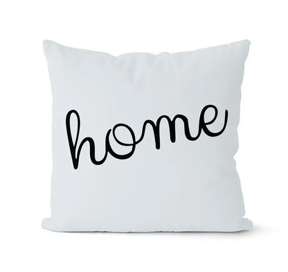 Modern geometric black and white pillowcase set featuring a white throw pillow with home in black cursive script decorbites geometric black