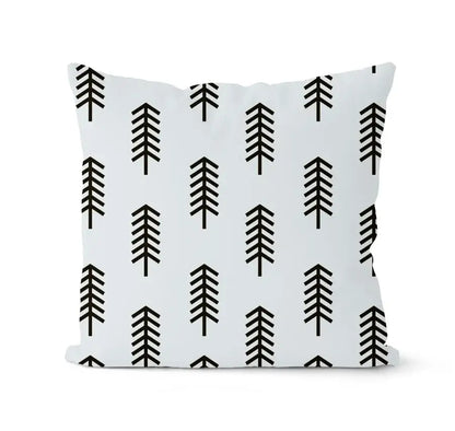 White throw pillow with a repeating black stylized pine tree pattern in the decorbites geometric black and white pillowcase set