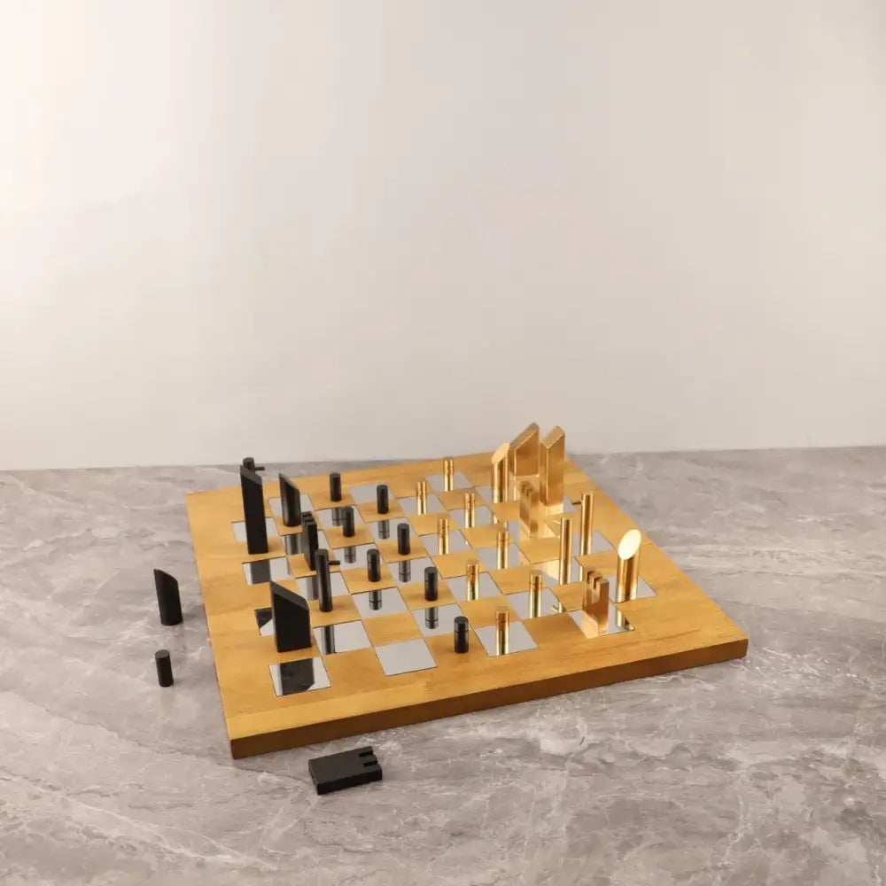 Modern geometric block chess set with gold and black wooden board and sleek metallic pieces for living room decorbites decor