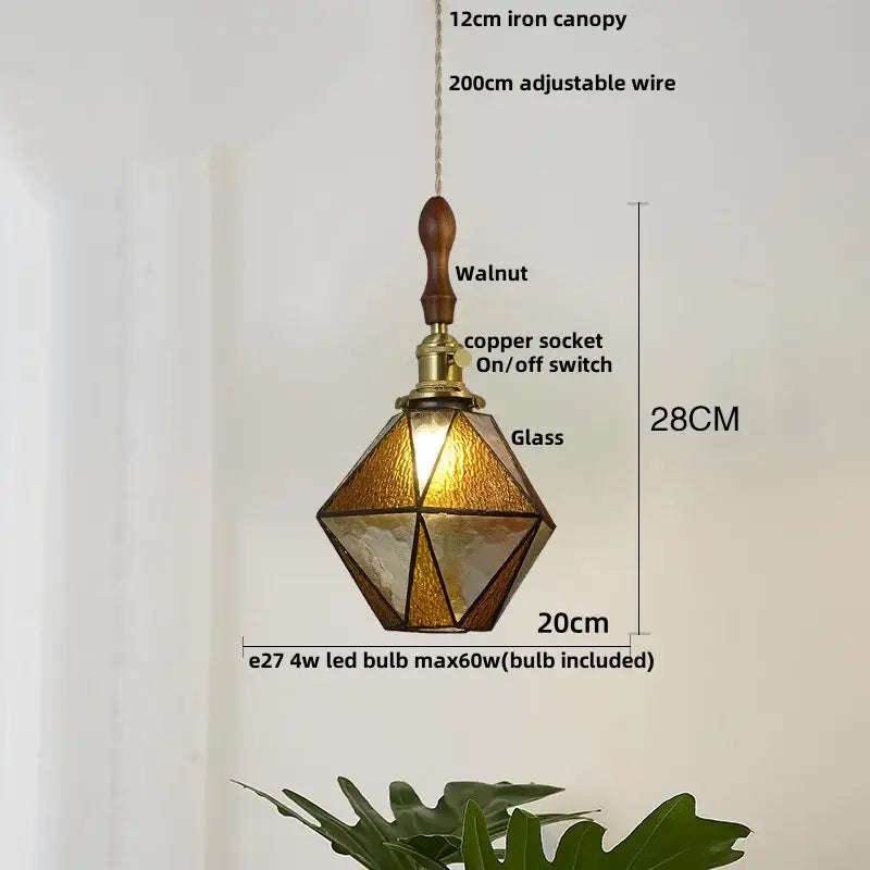 Modern geometric pendant light with blue glass panels and walnut handle perfect for dining room decorbites blue glass