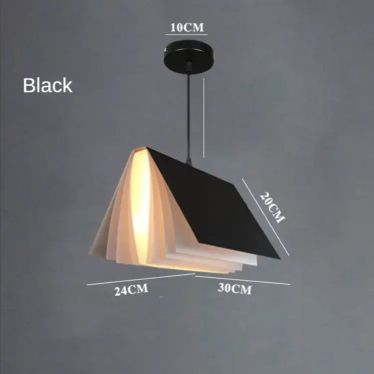Black book-shaped pendant lamp with layered pages and warm glow modern geometric decorbites book pendant for bedroom lighting