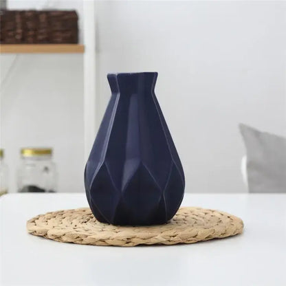 Deep navy blue decorbites ceramic diamond vase with faceted angular design for modern living room decor