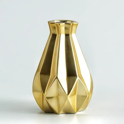 Gold-colored decorbites ceramic diamond vase with faceted geometric design for modern living room decor