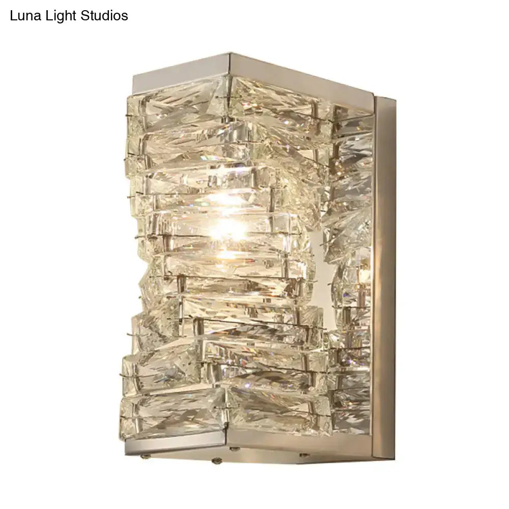 Modern geometric wall sconce with stacked clear crystal pieces in brushed nickel frame for living room lighting