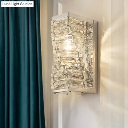 Modern geometric wall sconce with stacked clear crystal blocks in silver metal frame for living room lighting