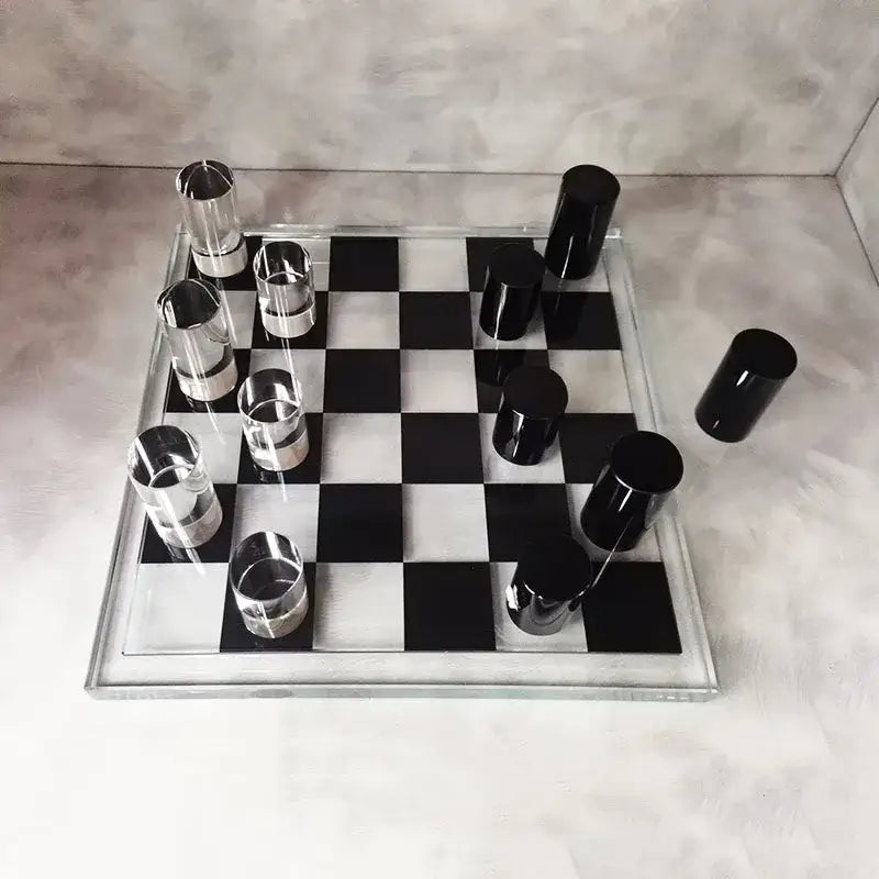 Modern geometric crystal chess set with transparent board and glossy black and silver cylindrical pieces for living room decorbites decor