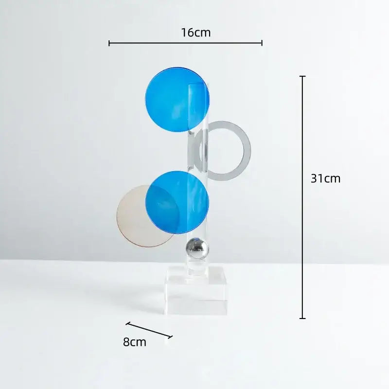 Modern geometric crystal circle sculpture with stacked blue, beige, and silver acrylic discs for home decor by decorbites