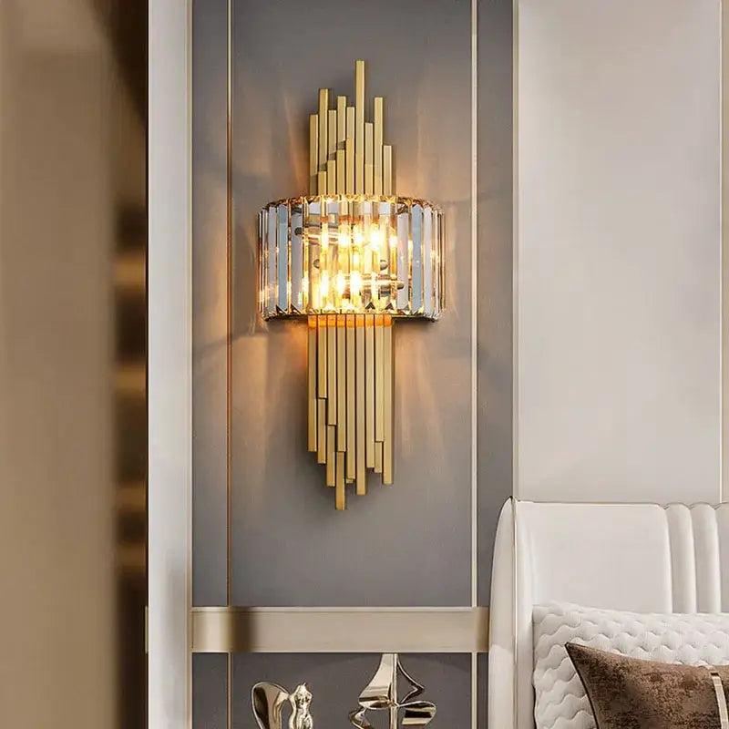 Gold-toned wall lamp with vertical crystal bars and central cylindrical glass shade for modern decorbites crystal gold wall decor