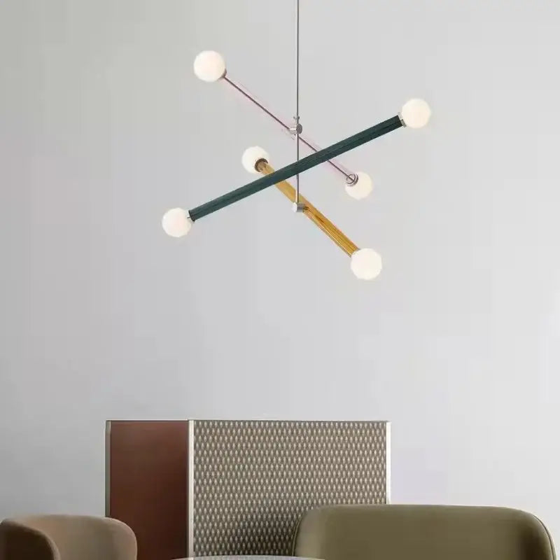 Modern geometric decorbites colorful chandelier with matte green, natural wood, and metal rods with frosted glass globes