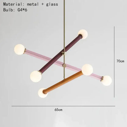 A modern geometric decorbites colorful chandelier with three intersecting arms in muted purple blush pink and wood tones