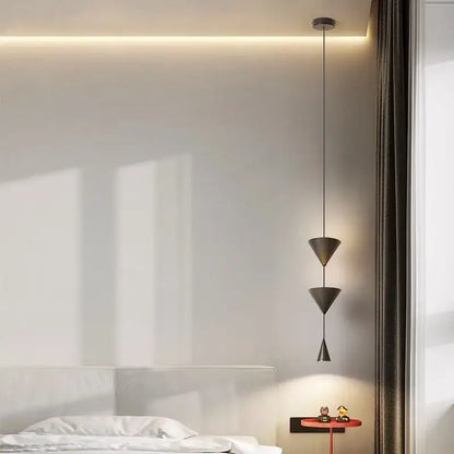 Modern black decorbites cone long led pendant light with sleek metallic finish and minimalist geometric design for bedroom use