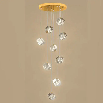 Modern geometric decorbites crystal led chandelier with warm gold circular ceiling mount and clear faceted pendant lights