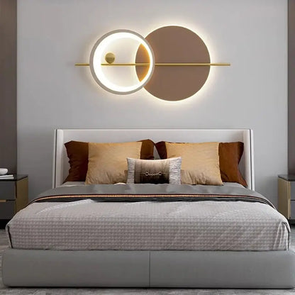 Modern geometric decorbites led wall sconce with glowing white ring gold accent and matte brown disc for bedroom light