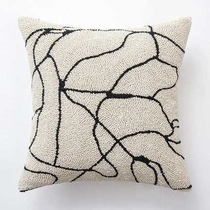Cream-colored cushion cover with bold black abstract lines featuring decorbites geometric embroidered design for living room decor