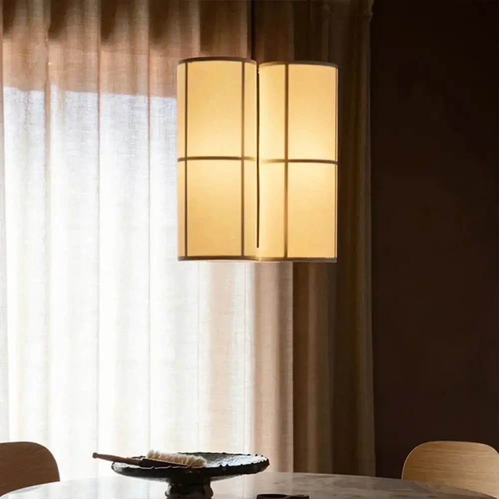 Modern geometric warm-toned fabric hashira cluster pendant light with segmented grid design and soft diffused glow for dining room