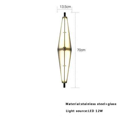 A sleek 70cm tall modern glass cone chandelier with tapered glass and stainless steel for dining room lighting