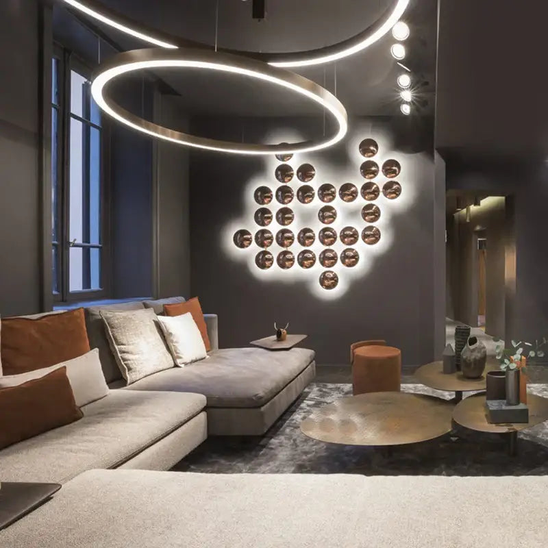 Modern geometric glossy gold led wall sconces with warm illumination and sleek metallic finish for living room decor