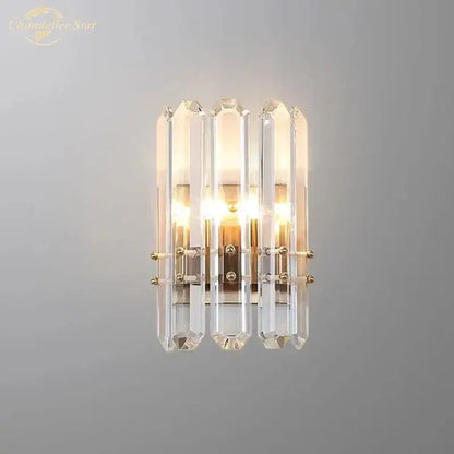Modern geometric gold crystal wall sconce with five clear glass rods in a nordic wall sconce design for living rooms
