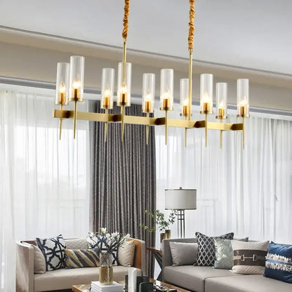 Modern geometric gold metal glass pendant light with gold-toned cylindrical glass shades for dining room decorbites gold metal