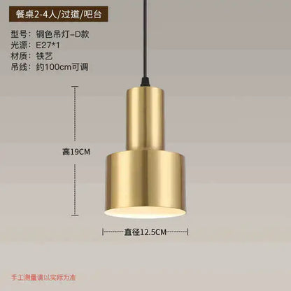 A sleek modern brass pendant light with cylindrical design and matte finish in decorbites gold nordic chandelier style