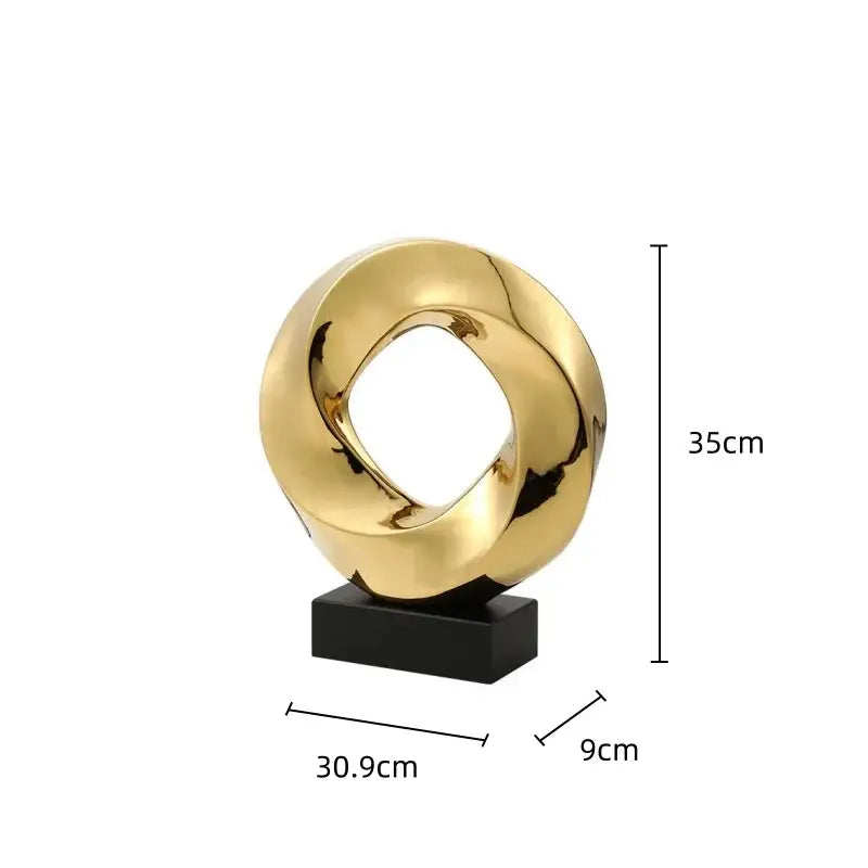 Modern geometric gold ring sculpture with a sleek gold ring hollow design on black base for living room decor
