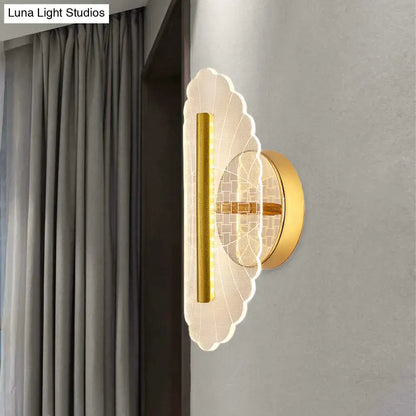 Modern geometric gold sconce light with scalloped translucent acrylic shade and vertical LED strip for living room