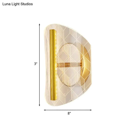 Modern geometric gold sconce light with frosted glass diamond pattern and polished metal trim for living room use