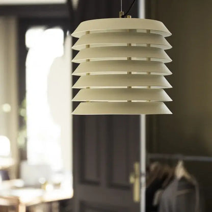 Modern geometric iron table lamp featuring a cream tiered pendant with sleek iron table lamp design for living room decorbites