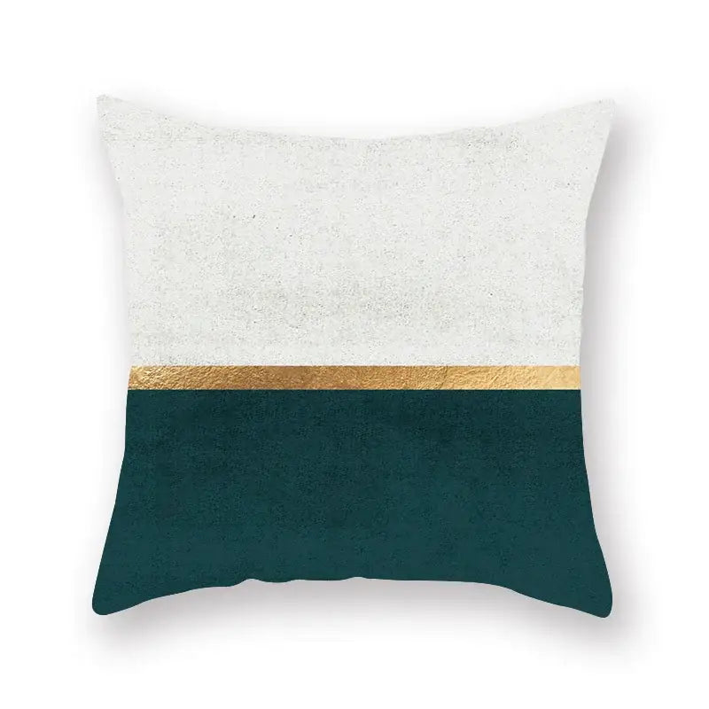 Modern throw pillow with textured white upper half metallic gold stripe and deep teal lower section decorbites geometric leaf design