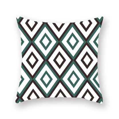 Square throw pillow with bold teal white and black geometric leaf flower pattern for decorbites living room decor