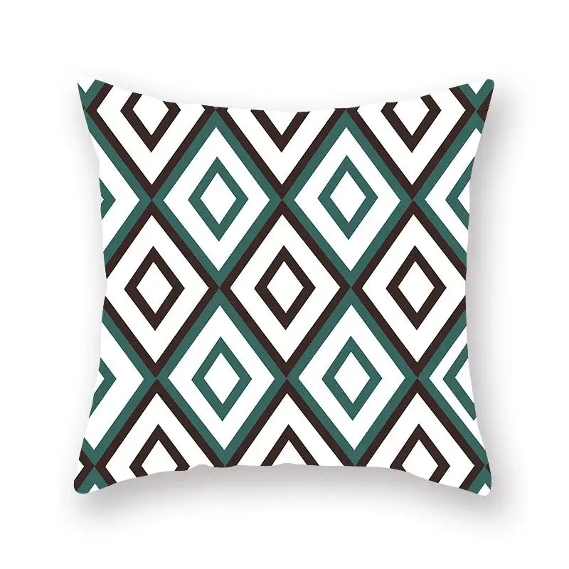Square throw pillow with bold teal white and black geometric leaf flower pattern for decorbites living room decor