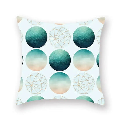 A square throw pillow with a modern decorbites geometric leaf pattern in teal peach and gold on white background