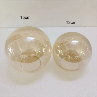 Two translucent amber glass globe lamp shades 15cm and 13cm diameter for modern geometric magic bean lighting