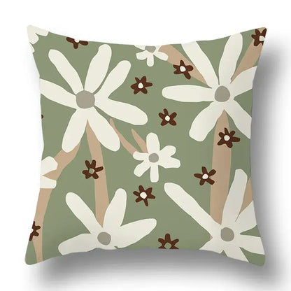 Square pillow cover with modern geometric print featuring white daisies and brown flowers on olive decorbites green plants background
