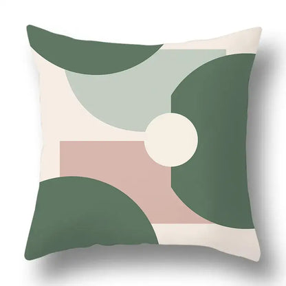 A square pillow cover with a modern geometric print in green beige and soft pink by decorbites green plants