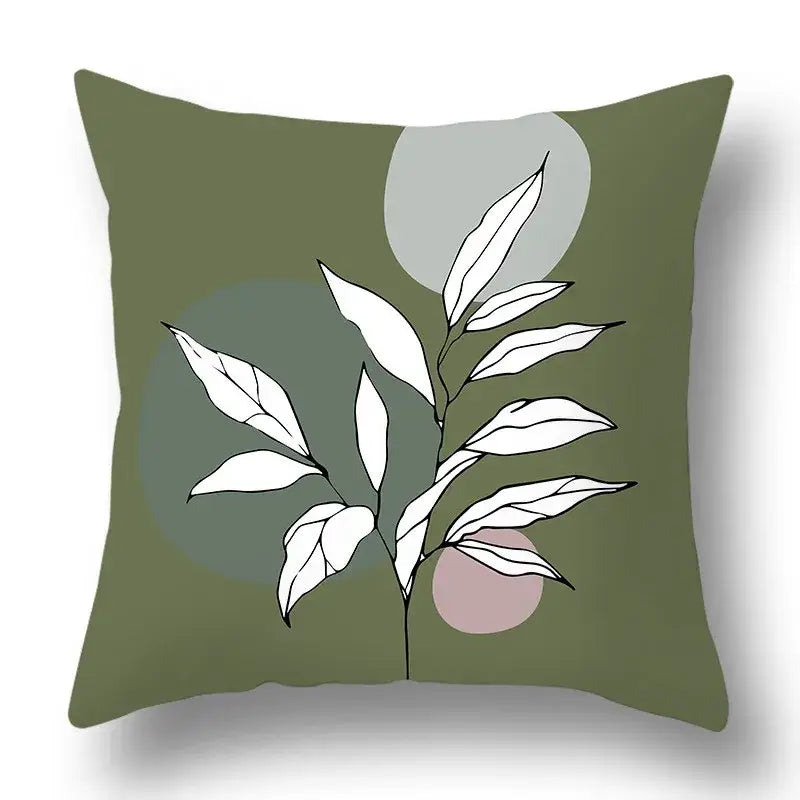 Olive green pillow cover with minimalist white leaf and abstract geometric print by decorbites green plants for living room decor