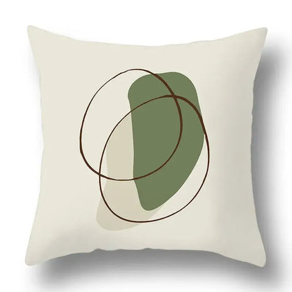 Cream-colored pillow cover with geometric print featuring sage green shape and thin brown lines decorbites green plants decor