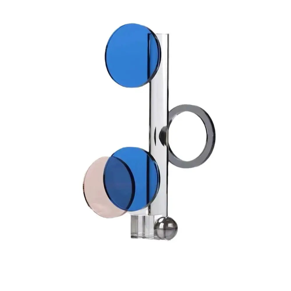 Modern geometric ring acrylic sculpture with translucent blue and pink discs and chrome accents for home decorbites crystal geometric home decor